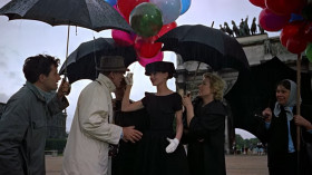 - I'm sorry, I'm nervous. I've never done anything like this.
- There's nothing to be nervous about. You're in Paris, the Tuileries. You've got balloons. There's a sudden shower. You're very happy.
- Why am I so happy?
- Because I say you are.